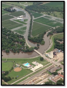 Aerial image of a levee with a channel during a flood